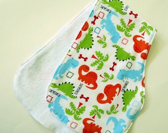 Contoured Burp Rag: Colorful Dinosaurs with White Terrycloth