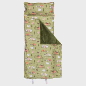 May include: A green sleeping bag set with a farm animal pattern. The set includes a pillow and a blanket with a repeating pattern of pigs, sheep, tractors, and barns. The blanket has a dark green, plush interior.