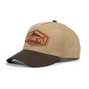 May include: A tan baseball cap with a brown bill. The cap features a leather patch with a marlin illustration and the text "Rangelab". The cap is a classic six-panel design.