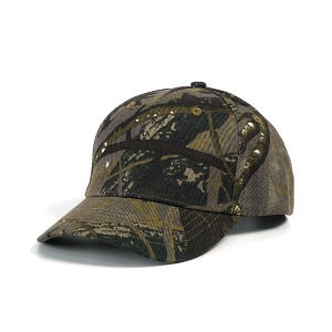 May include: A camouflage baseball cap in shades of green, brown, and tan. The cap features a curved brim and a button on top. The fabric has a textured appearance, and the design is a classic woodland camouflage pattern.