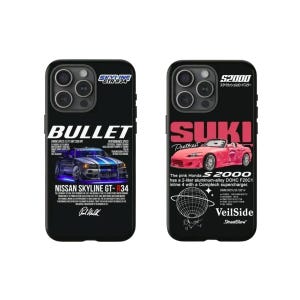 May include: Two black phone cases with car graphics. One case features a blue Nissan Skyline GT-R34 with the text "BULLET" and "NISSAN SKYLINE GT-R34". The other case displays a pink Honda S2000 with "SUKI" and "S2000" text.