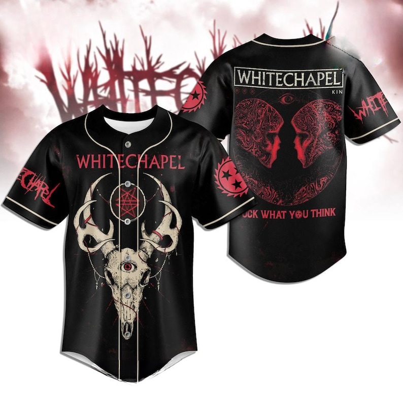 May include: Black baseball jersey featuring the band name "WHITECHAPEL" and a skull graphic with an eye. The jersey has white trim and the band's logo on the sleeves. The back of the jersey has the band's name and a graphic of two faces.