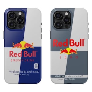 May include: Two phone cases featuring the Red Bull logo. One case is blue and white with "ENERGY DRINK" text, the other is gray and white with "ZERO" text. Both cases have the Red Bull logo and the text "Vitalizes body and mind. 250 ml (8.4 FL OZ)."