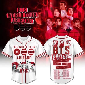 May include: White baseball jersey with red trim and the text "BTS WORLD TOUR ARIRANG". The front features a group photo and the back has band member images and tour dates. The jersey has short sleeves.