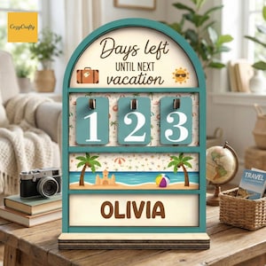 May include: A teal wooden vacation countdown calendar with the text "Days left until next vacation." It has three number tiles showing "123" and a bottom panel with the name "OLIVIA." The design includes beach and travel-themed illustrations.