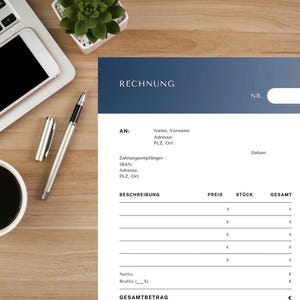 May include: A business invoice in German, labelled "RECHNUNG". The document includes fields for recipient information, payment details, and itemized costs. A laptop, pen, and coffee cup are on the wooden surface.