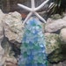 Nancy Warrick reviewed Seaglass Tree White Finger Starfish Top Choice of Color Coastal Christmas Topiary Sea Glass Tabletop Mantle Beach Display Nautical Decor