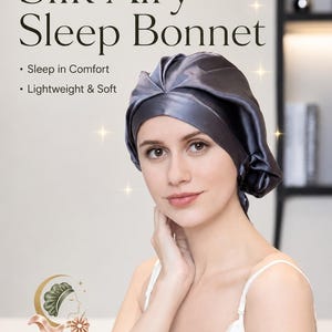 May include: A dark grey silk sleep bonnet with a gathered design. The text reads: Cloud-Like Hair Care, 100% Mulberry Silk, Silk Airy Sleep Bonnet, Sleep in Comfort, Lightweight & Soft, Mulberry Glow, Luxury Silk for Hair, Skin & Sleep.