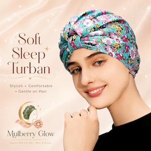 May include: A turquoise sleep turban featuring a vibrant floral pattern in shades of pink, white, and yellow. The text on the image reads Soft Sleep Turban, Stylish, Comfortable, Gentle on Hair, Mulberry Glow, and Luxury Silk for Hair, Skin & Sleep.