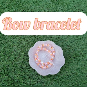 pearl bow clay bead bracelet