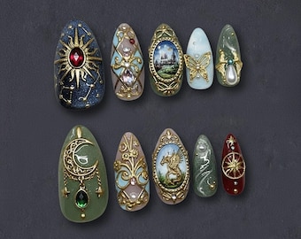 May include: A collection of ten intricately designed, almond-shaped press-on nails. Each nail features unique embellishments, including gold filigree, gemstones, and miniature paintings of castles, butterflies, and celestial motifs. The color palette includes blues, greens, and reds.