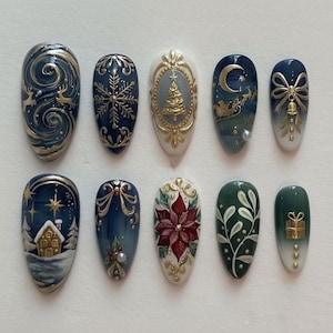 May include: A set of ten oval-shaped, painted fingernails with a Christmas theme. Designs include a reindeer scene, snowflakes, a Christmas tree, a sleigh, a bow, a house, a poinsettia, and a gift. Colors include navy blue, gold, white, and red.