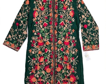 May include: A dark green long-sleeve tunic featuring a mandarin collar and a front button closure. The garment is decorated with intricate floral embroidery in shades of red, orange, and light pink, extending across the front and sleeves.