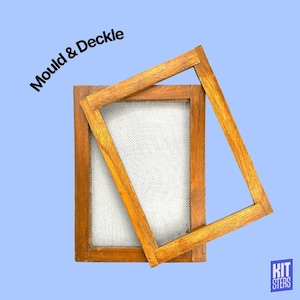 May include: A wooden mould and deckle set for papermaking. The set includes a rectangular frame with a mesh screen and a separate wooden frame. The text "Mould & Deckle" is printed on the top left corner. The background is light blue.