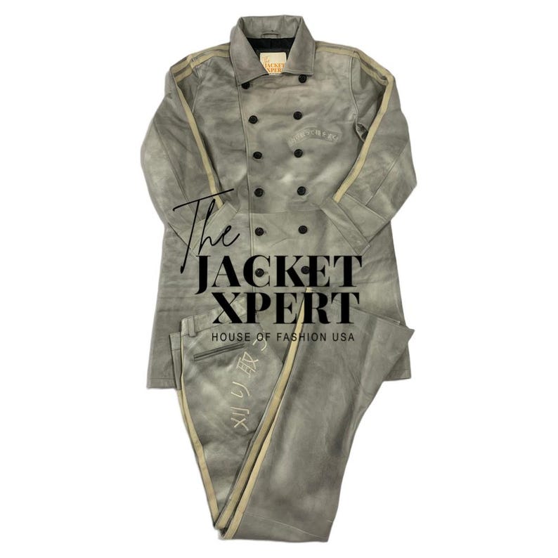 May include: A gray two-piece suit with a double-breasted jacket and matching pants. The jacket has black buttons and tan stripes down the sleeves. The pants have tan stripes down the sides. The text "The JACKET XPERT HOUSE OF FASHION USA" is visible.