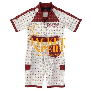May include: A two-piece matching set featuring a short-sleeved collared shirt and shorts. The set is white with a repeating pattern of small red diamonds and the letters "MCM". The shirt and shorts have red trim and pockets. The word "MCM" is printed on the shirt.