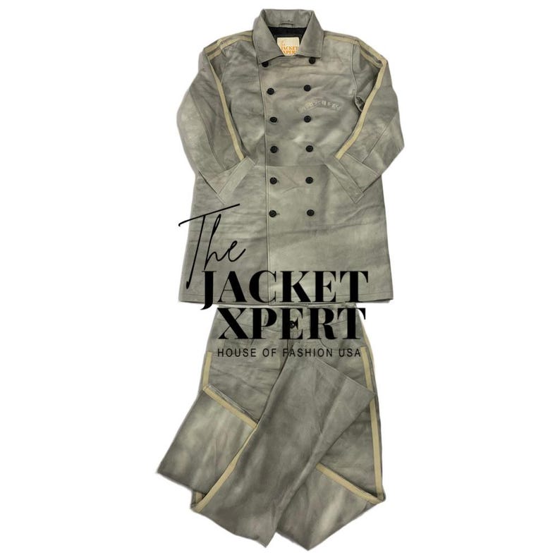 May include: A gray suede jacket and matching pants set. The jacket is double-breasted with black buttons and beige stripes on the sleeves. The text "The Jacket Xpert" and "House of Fashion USA" are visible.