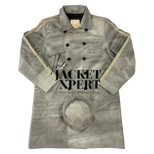 May include: A light gray suede jacket with a matching hat. The jacket has a double-breasted design with black buttons, cream-colored stripes on the sleeves, and the text "The JACKET XPERT HOUSE OF FASHION USA".