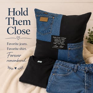 May include: A square throw pillow constructed from blue denim jeans and black fabric, featuring two denim pockets and a black patch with white text reading: Made from clothes I used to wear... Whenever you hold it know that I am there. Love, Dad.
