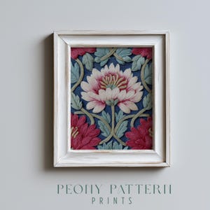 May include: A framed print with a floral design. The artwork depicts a large peony flower in pink and white, with green leaves and vines on a blue backdrop. The frame is white with a distressed finish. The text at the bottom reads "PEONY PATTERN PRINTS."