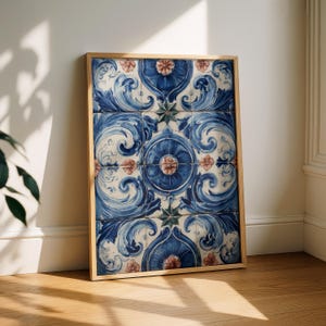 May include: A rectangular wall art piece in a light wood frame featuring a grid of ceramic tiles. The tiles display a repeating pattern of deep blue swirling acanthus leaves, central circular medallions, and small pink floral accents on white.