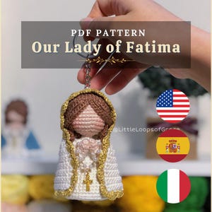 May include: A handmade crochet keychain featuring Our Lady of Fatima. The doll has a white robe with gold trim, a brown head covering, and a gold cross pendant. The image includes the text "PDF PATTERN Our Lady of Fatima".