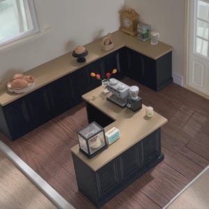 May include: Miniature kitchen scene with black cabinets, light countertops, and a wooden floor. Includes a coffee machine, pastries, and decorative items. The scene is set in a dollhouse-style environment.