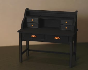 May include: A miniature black desk with a hutch, featuring two small drawers on each side of the hutch and two larger drawers below. The drawer pulls are a copper color. The desk has a classic design.