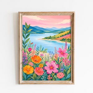 May include: A framed wall art print featuring a vibrant landscape illustration of a blue lake surrounded by rolling hills under a soft pink sky, with a foreground filled with colorful wildflowers in shades of pink, orange, and yellow.