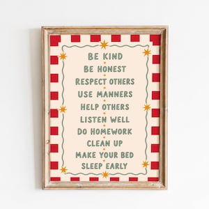 May include: A framed wall art print featuring a cream-coloured background with a red and white striped border. The text reads: BE KIND, BE HONEST, RESPECT OTHERS, USE MANNERS, HELP OTHERS, LISTEN WELL, DO HOMEWORK, CLEAN UP, MAKE YOUR BED, SLEEP EARLY.