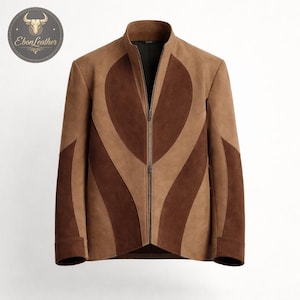 May include: A brown suede jacket with a unique design. The jacket features a high collar, a full-length zipper, and a pattern of alternating light and dark brown curved panels. The jacket is a medium weight and appears to be new.