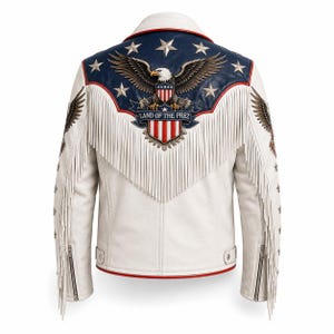 May include: A white leather motorcycle jacket featuring a blue yoke with a bald eagle graphic, white stars, and the text "LAND OF THE PREZ" above a red and white striped shield. The jacket includes long white fringe trim and silver zippers.