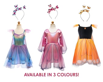 May include: Three dresses with matching butterfly headbands. The first is iridescent blue and purple, the second is metallic pink with sheer sleeves, and the third is black and orange with butterfly wing patterns. Text reads: AVAILABLE IN 3 COLOURS!