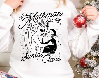 Funny Mothman Kissing Santa Claus Christmas Sweatshirt, Cryptid Holiday Shirt