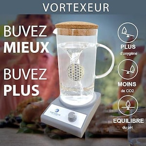 May include: A clear glass pitcher with a cork lid sits on a gray electric vortex base. The pitcher contains water with a visible vortex and a gold flower of life symbol. Text includes VORTEXEUR, BUVEZ MIEUX BUVEZ PLUS, and icons for oxygen, CO2, and pH.