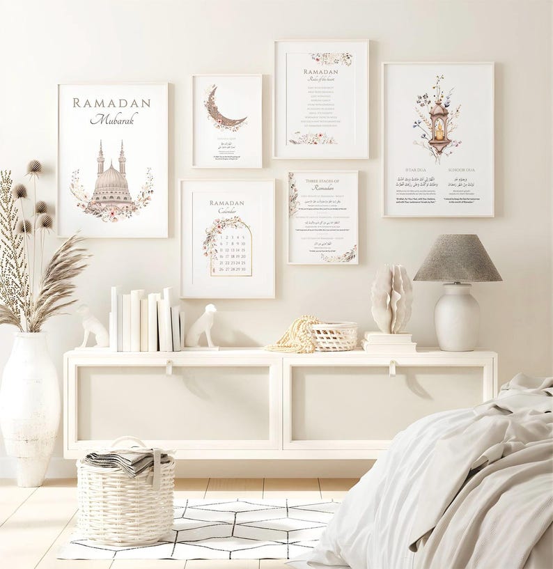 May include: A collection of framed art prints with a Ramadan theme. The prints feature floral designs, a crescent moon, a mosque, and the words "Ramadan Mubarak." The color palette includes white, beige, and soft pastel tones, creating a serene and elegant aesthetic.