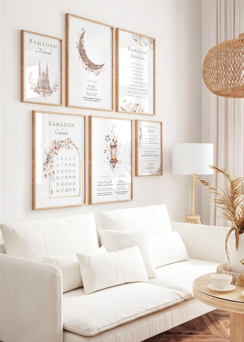 May include: A collection of framed wall art with a Ramadan theme. The art features floral and architectural designs, along with the words "Ramadan Mubarak" and "Ramadan Calendar". The frames are a light brown color, and the overall aesthetic is soft and inviting.