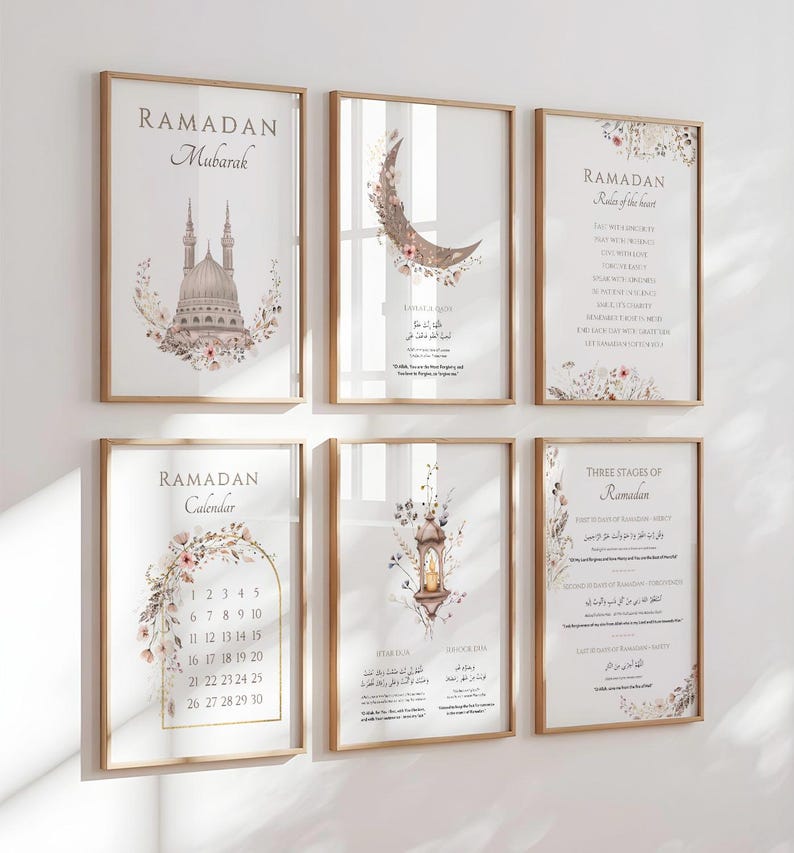May include: Set of six framed art prints with a Ramadan theme. The prints feature calligraphy, floral accents, and imagery of a mosque, crescent moon, and lantern. The frames are a light wood color, and the prints are displayed on a white wall.