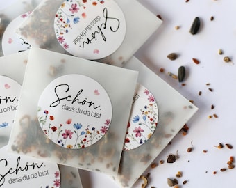 Party favor: flower seeds – “So glad you’re here” sticker – sachet with wildflower mix