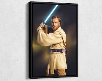 May include: Framed canvas art print featuring a portrait of a man holding a glowing blue lightsaber. The man is dressed in a tan robe and has a brown beard. The artwork is set against a dark background.