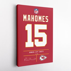 May include: Red canvas art featuring the name "MAHOMES" and the number "15" in white and gold. The Kansas City Chiefs logo and signature are also visible. The NFL logo is at the top. A sports-themed wall decor item.