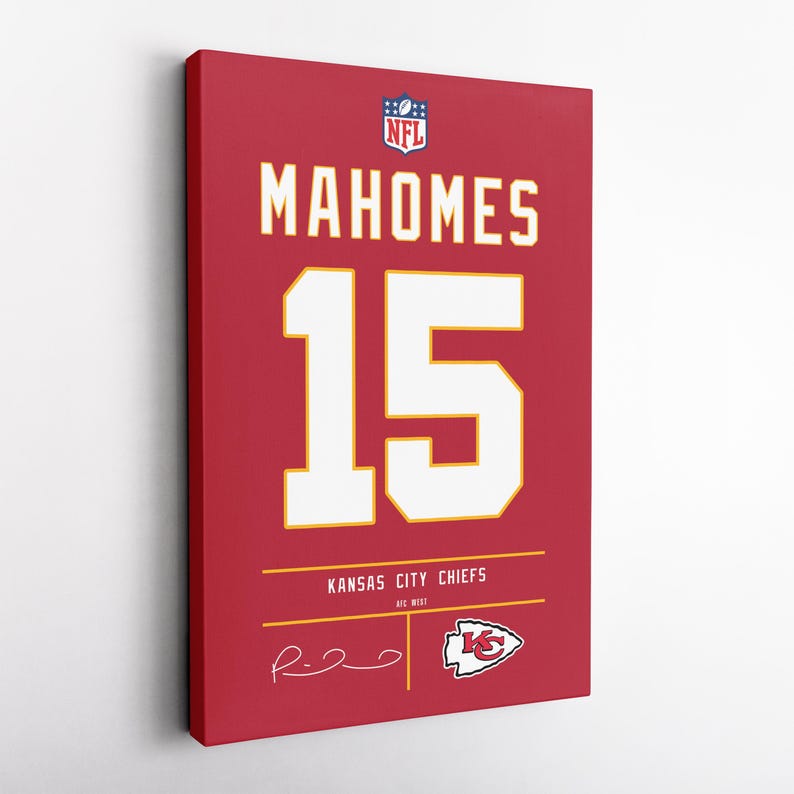 May include: Red canvas art featuring the name "MAHOMES" and the number "15" in white and gold. The Kansas City Chiefs logo and signature are also visible. The NFL logo is at the top. A sports-themed wall decor item.