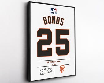May include: Framed San Francisco Giants jersey featuring the name "BONDS" and the number "25" in black and orange. The MLB logo is at the top, with the team name and signature at the bottom. The jersey is displayed in a black frame.