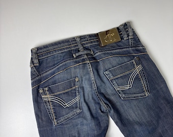 Vaqueros vintage Roberto Cavalli: denim italiano desgastado Y2K con forro de leopardo