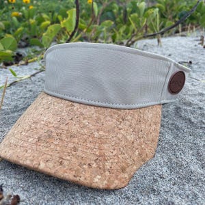 Beige natural cork visor, with minimalist design , made from recycled materials