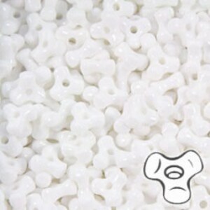 May include: A bulk bag of white, opaque, plastic beads. The beads are shaped like a Y with a hole in each arm. The beads are approximately 6mm in diameter.
