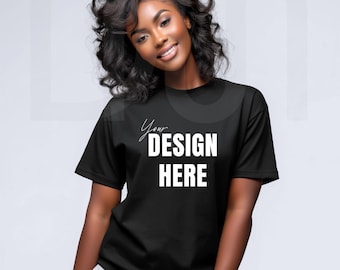 May include: A black t-shirt with the text "Your DESIGN HERE" in white. The shirt is short-sleeved and appears to be made of a soft material. The model is smiling and wearing the shirt.