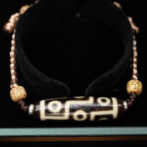 Perlina Dzi tibetana a 9 occhi
