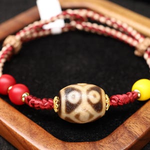 Bracciale tibetano con perline Dzi a 9 occhi