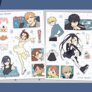 May include: Clear sticker sheets featuring anime-style illustrations of characters and objects. The stickers include images of people, food, and decorative elements. The text "GOE +5!!" is visible on one sticker. The text "Clear Sticker Sheets" is also visible.